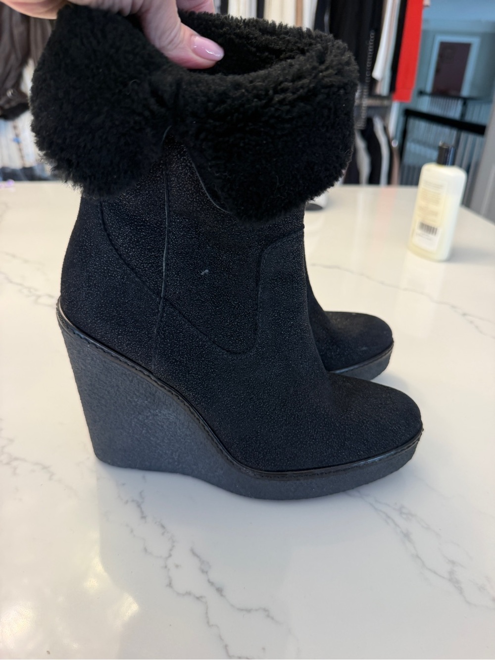 Moncler Black wedge shearling boots.
